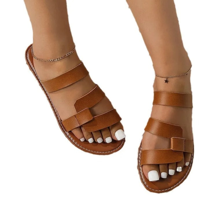 LD | Platte sandalen met open rug en gespversiering